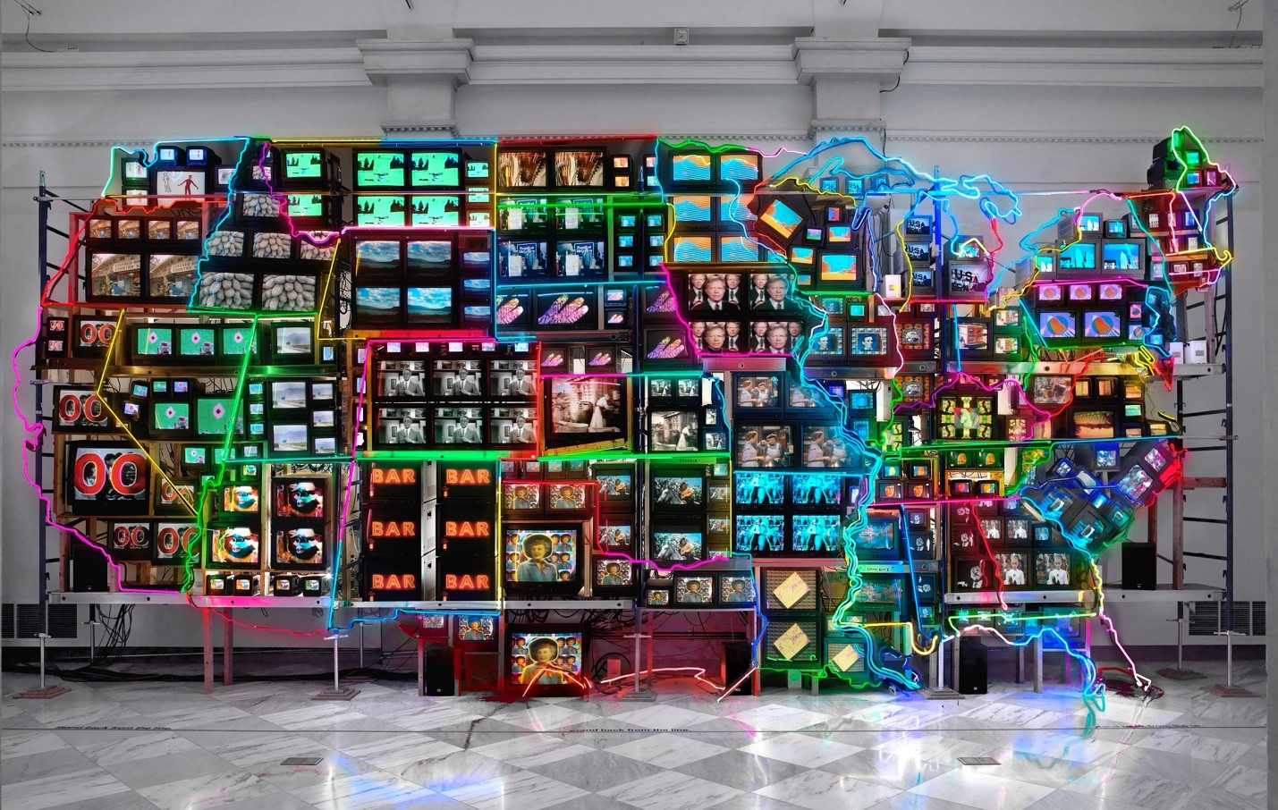 Colorful artwork rendition of a map of the United States superimposed over televisions displaying different images.